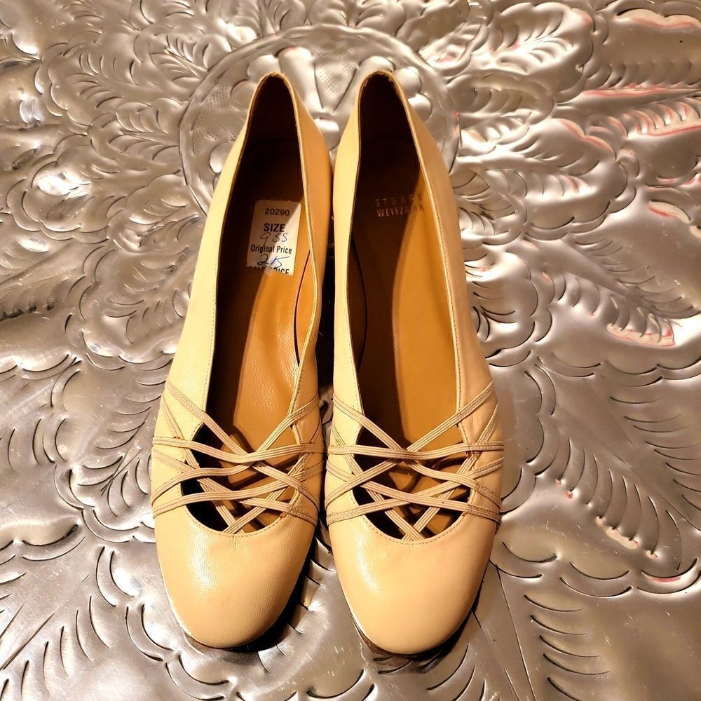 A pair of Stuart Weitzman flats,withcrisscross elastic, at the front ,so pretty!